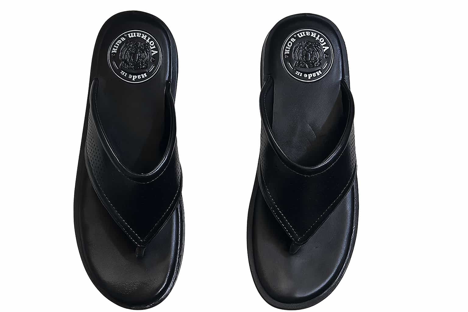 Pair of black slippers with brand logo on a white background