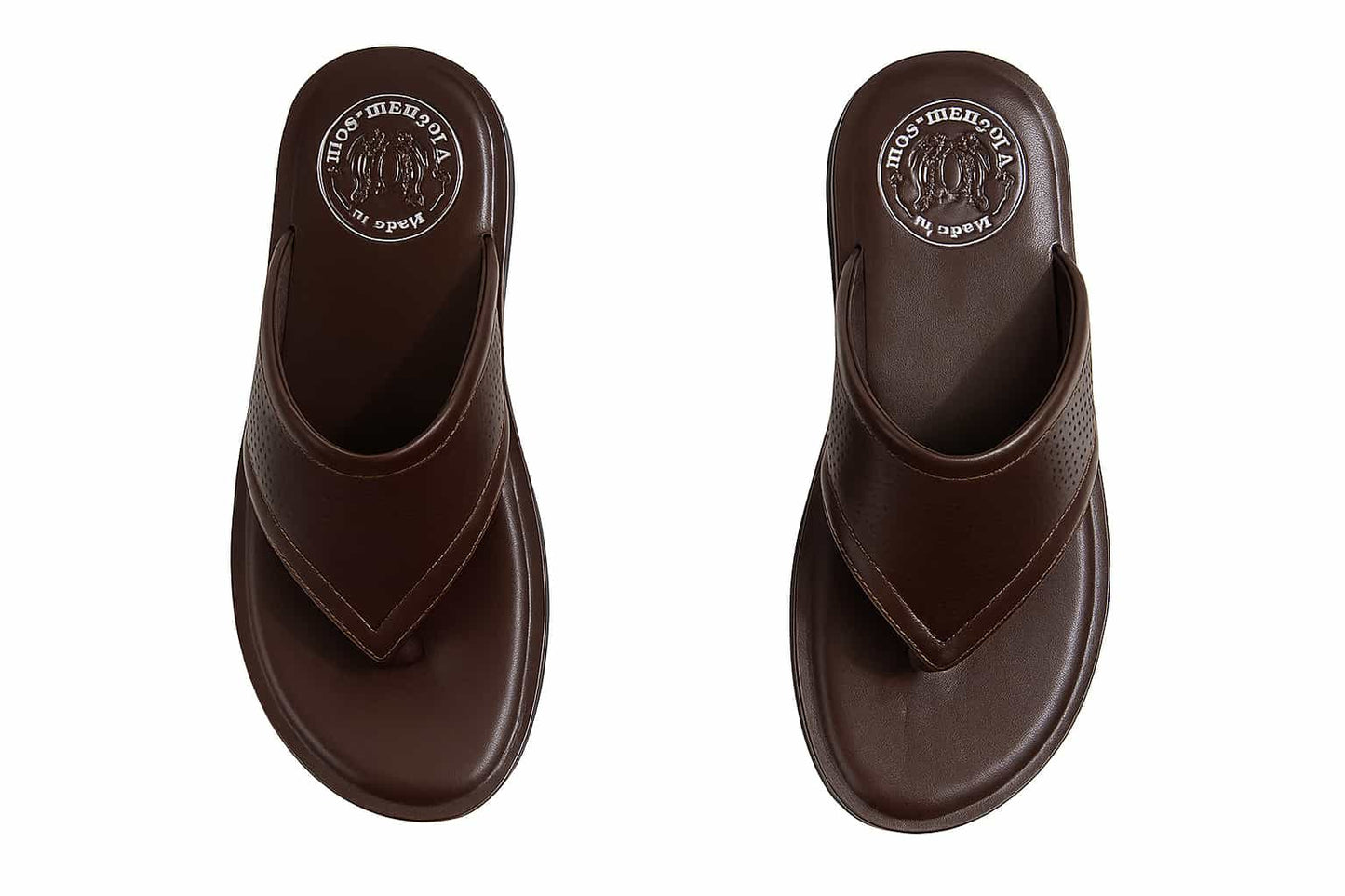 Pair of brown slippers with a visible brand logo on a white background