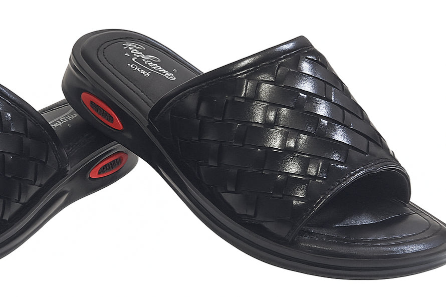 Black woven slippers with black sole on a white background