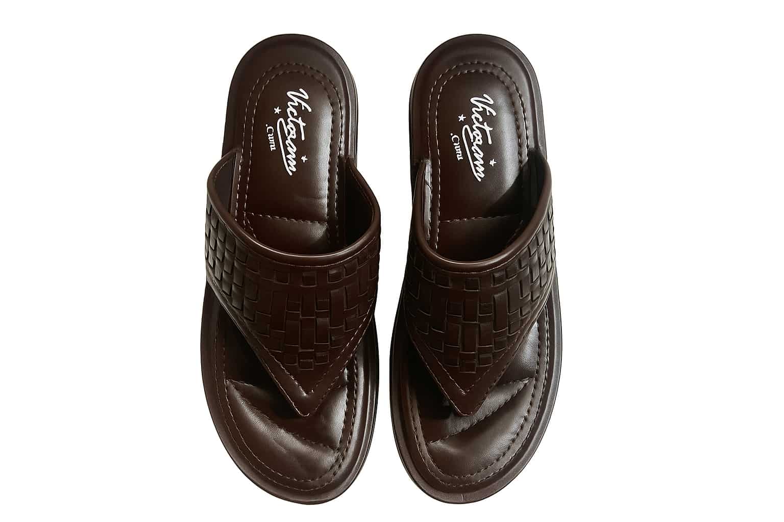 Pair of brown slippers with woven pattern on a white background