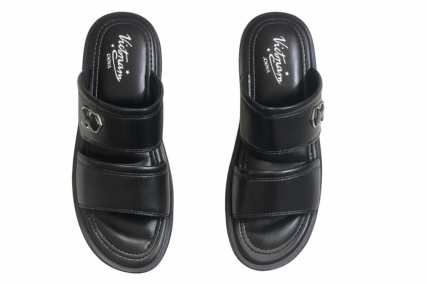 Pair of black slippers with a brand logo on a white background