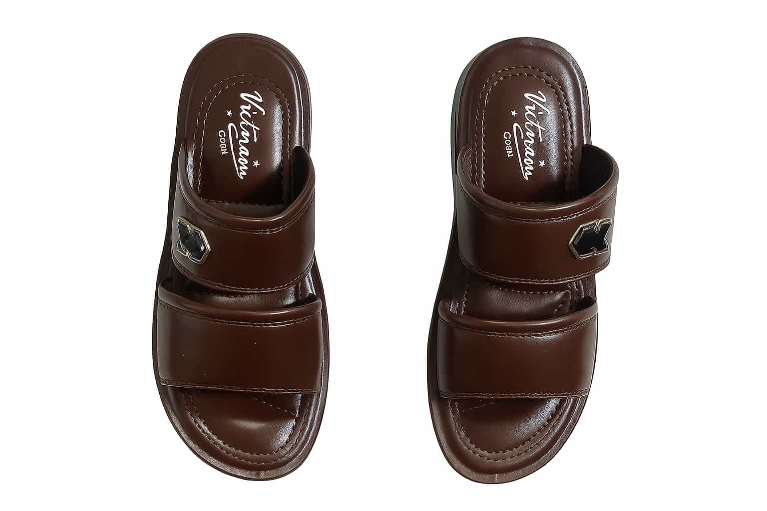 Pair of brown slippers with 'Vietnam' branding on a white background